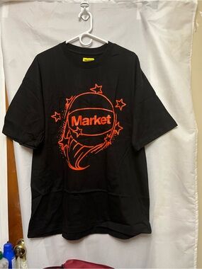Market Black Tee with Red Graphic NEW Size  Large. Color red/ orange